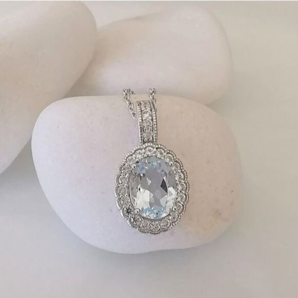 Diamond halo around Sky Blue Topaz pendant necklace - Picture 3 of 9